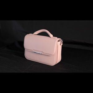 Calvin Klein small top handle faux leather crossbody bag in pink